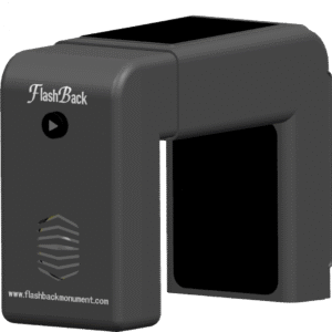 3D rendering of the FlashBack memorial audio device, showing the play button, speaker grill, solar panel, and headstone clamp design.