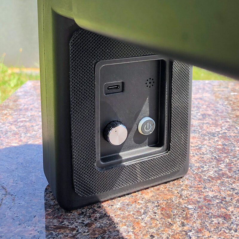 protective-padding Close-up of the FlashBack memorial device's control panel, showing the USB-C charging port, volume knob, microphone, and power button.